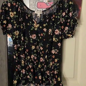 A dress shirt. Size small. Black with flowers